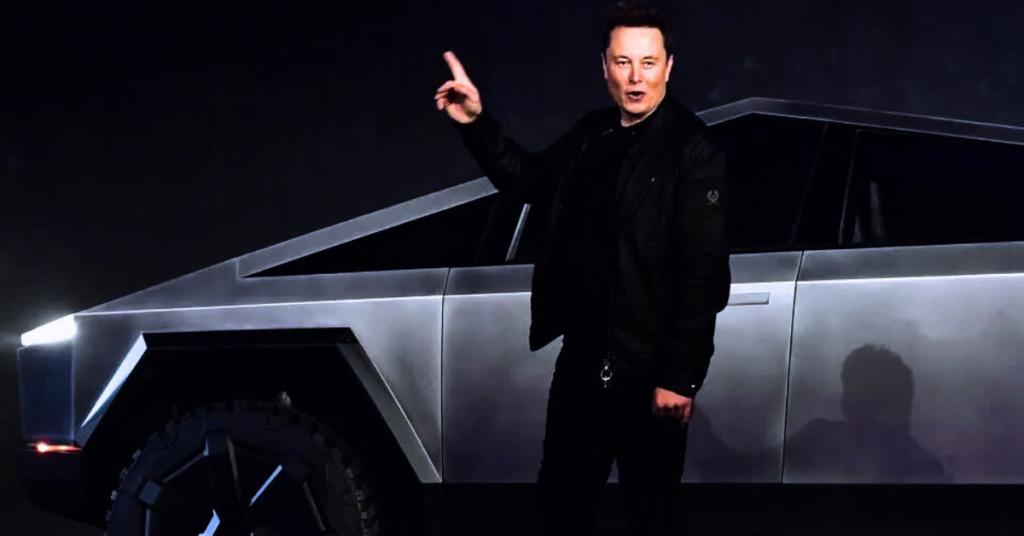 Image of Elon Musk giving a presentation about Tesla cars